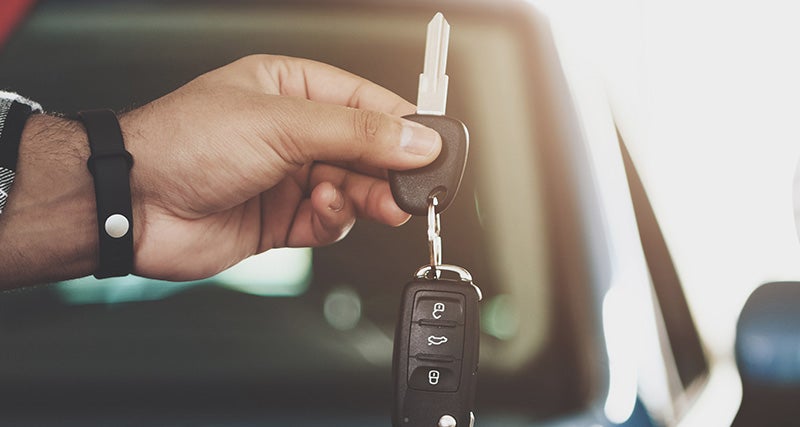 person holding car keys